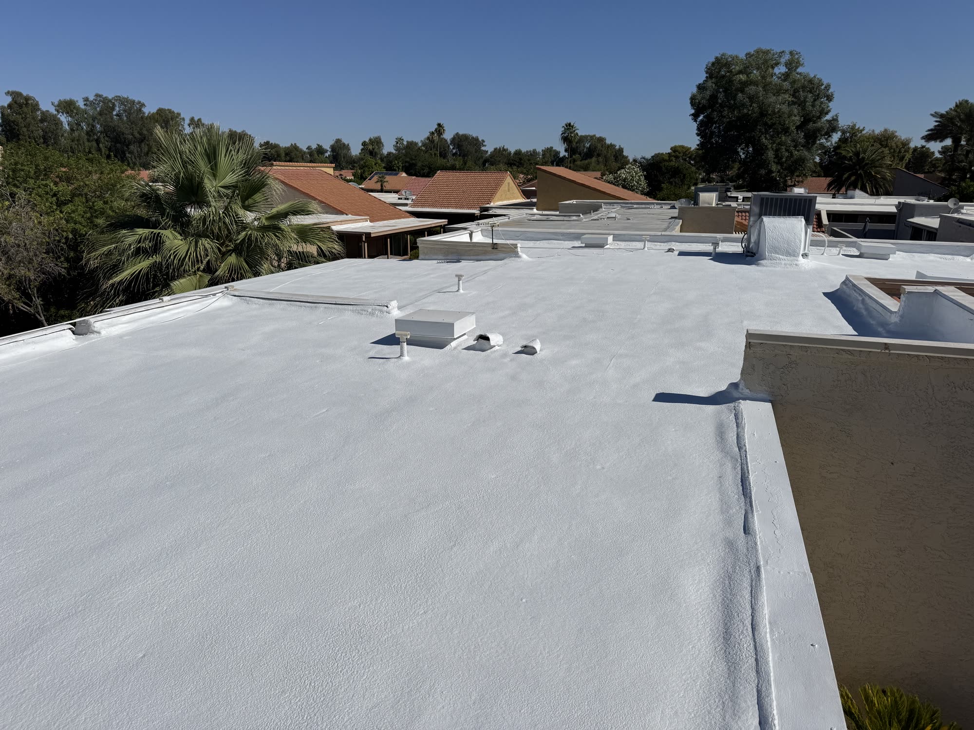 Reflective elastomeric roof coating on a Colorado low-slope roof