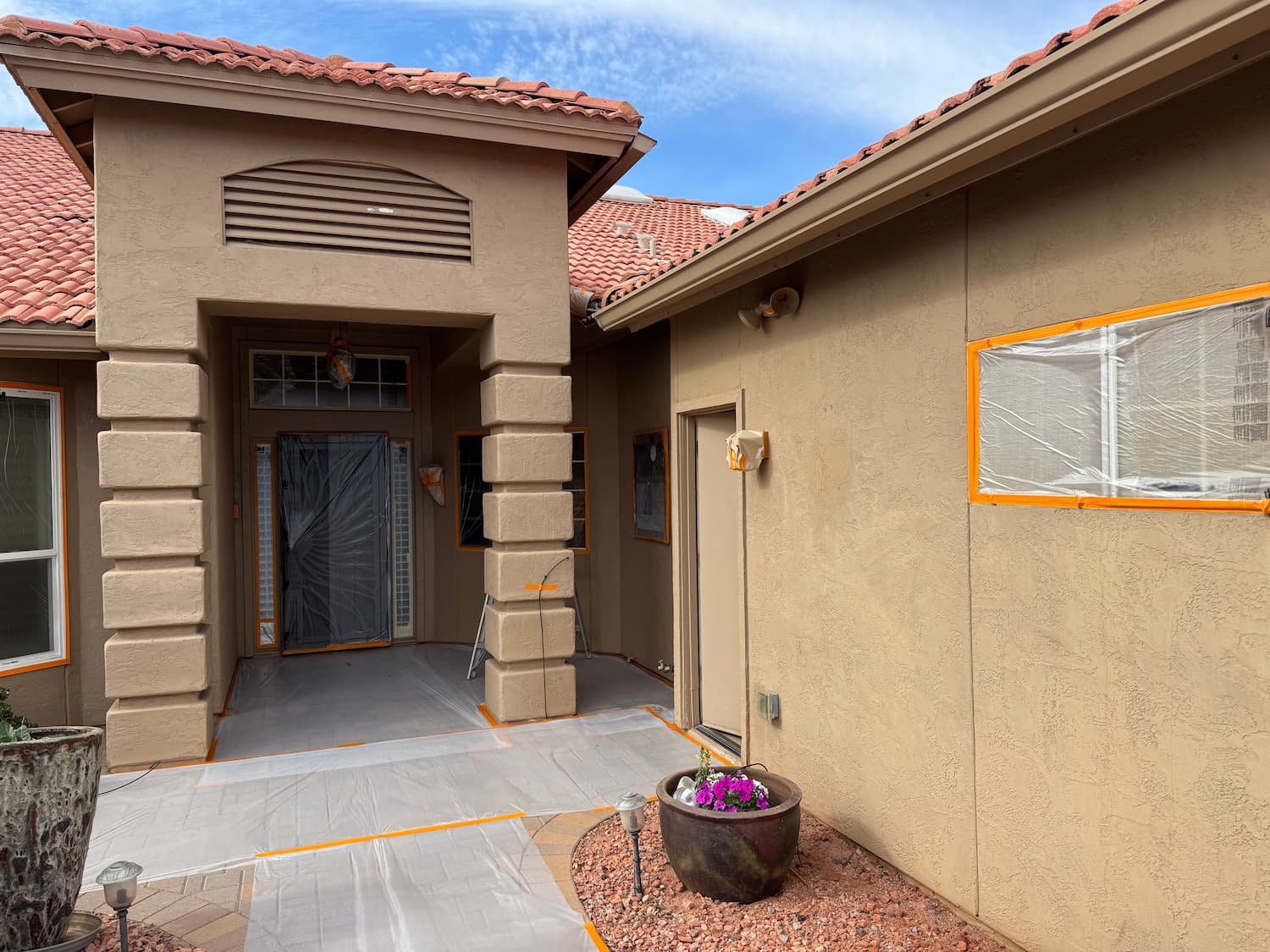 Stucco repair work matching original texture and color